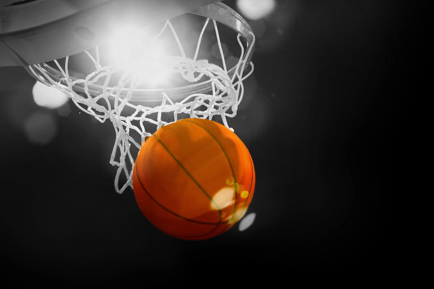 Basketball going through the hoop